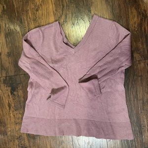 Light purple v-neck sweater with detail on elbows.